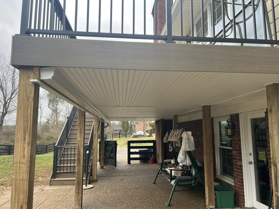 The underside of a newly built deck showing support structure and ceiling by Decks Unlimited in Littleton, CO.