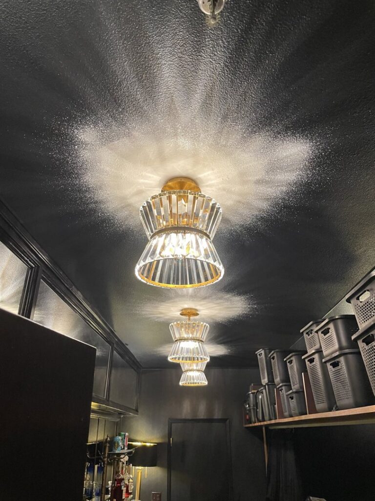 Multiple decorative ceiling light fixtures installed on a dark ceiling by Absolute Integrity Handyman Services Inc in Fresno, CA.