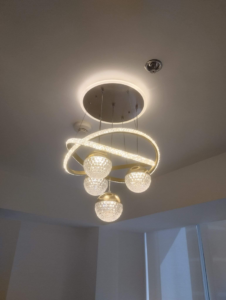 A decorative chandelier with crystal balls and LED rings installed by Electrician on Call and Home Service in Taguig, PH.