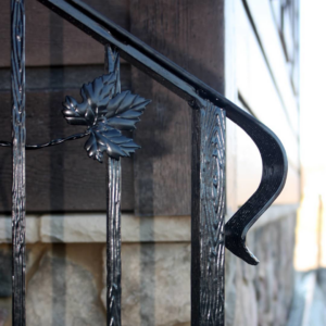 Close-up detail of a decorative leaf on a custom metal railing by Custom Railing Solutions in Norfolk, VA