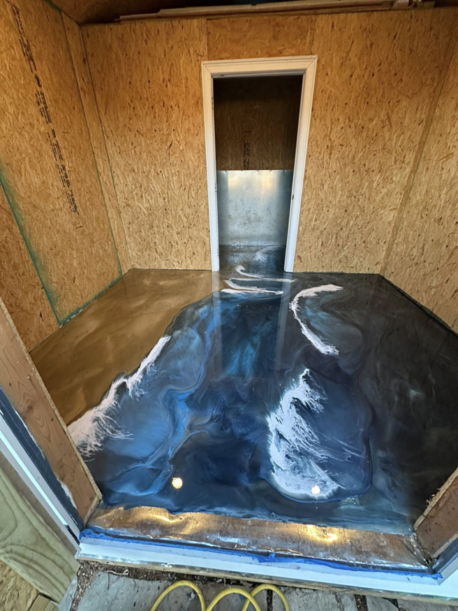 A stunning decorative ocean wave epoxy floor completed by Galaxy Epoxy in Madison, AL.