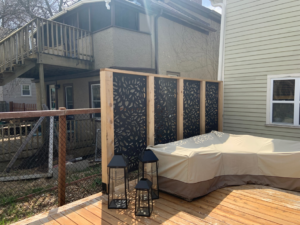 Decorative privacy screens with a leaf pattern installed on an outdoor deck by Elde Contracting in Saint Paul, MN.