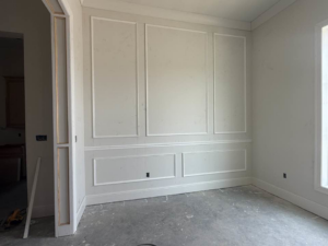Decorative wall molding installation completed in a room by Royston Construction in Lafayette, LA
