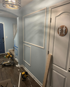 Decorative wall trim being installed in a home, a service provided by Unto GOD's Kingdom Builders in Mint Hill, NC.