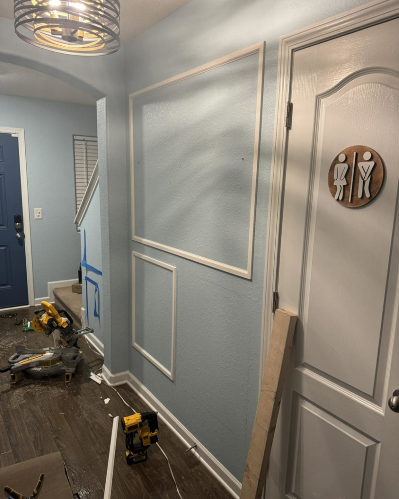 Decorative wall trim being installed in a home, a service provided by Unto GOD's Kingdom Builders in Mint Hill, NC.