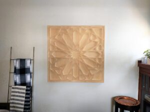 A decorative wooden geometric wall art piece expertly hung on a wall by Boise Handyman & Remodel in Boise, ID.
