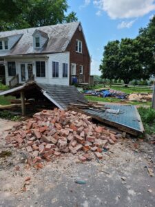 A large pile of bricks and wood from a demolished structure, ready for Junk Unlimited Junk Removal in Laurel, MD.