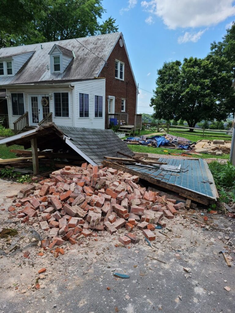 A large pile of bricks and wood from a demolished structure, ready for Junk Unlimited Junk Removal in Laurel, MD.