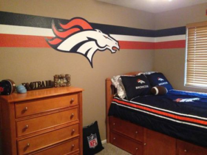 A professionally painted Denver Broncos themed bedroom by Cali Painting in Fort Collins, CO