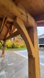 A close-up detail of a sturdy wooden pergola post and beam, showcasing craftsmanship by Minnesota Pergolas in Lakeland, MN.