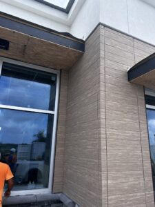 Detailed commercial siding work around a window on a building exterior by M&J Florida Enterprise Llc in Orlando, FL.