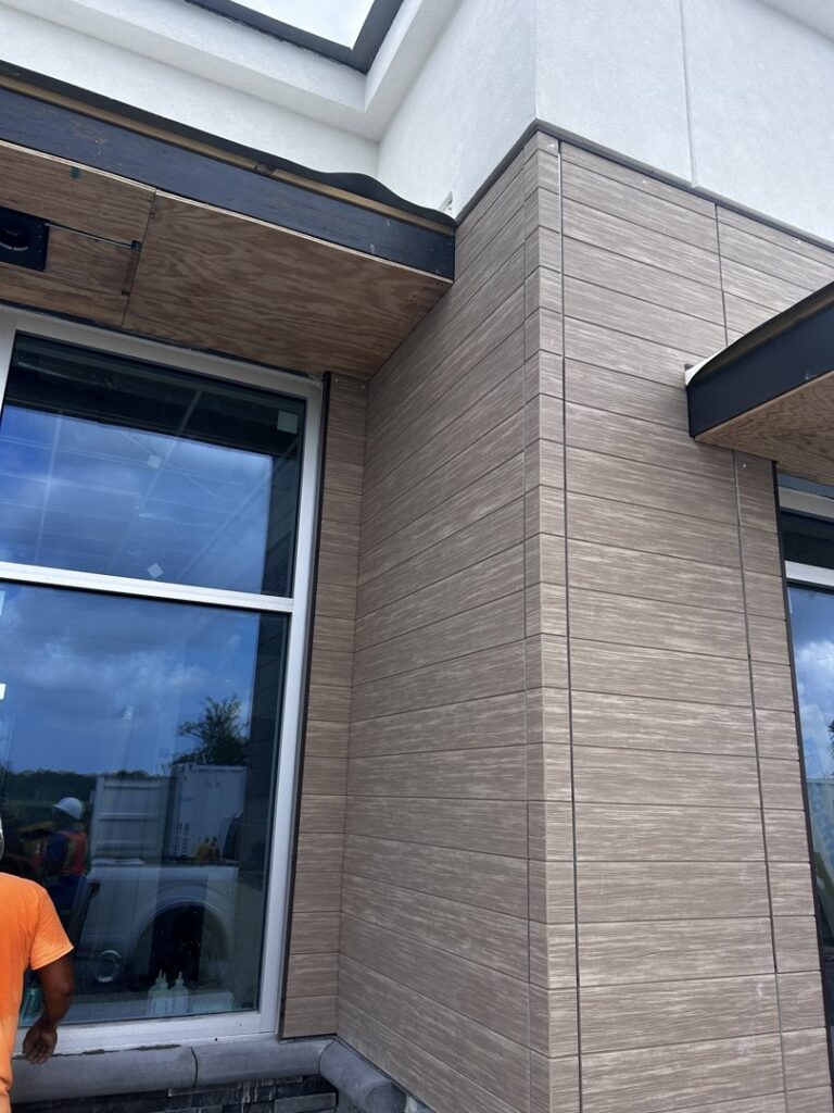Detailed commercial siding work around a window on a building exterior by M&J Florida Enterprise Llc in Orlando, FL.