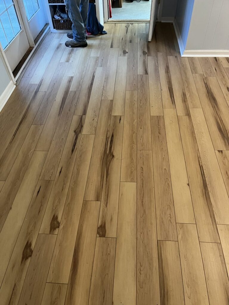 Detailed view of new wood plank flooring installation, a quality service by Hill Renovations LLC in Athens, GA