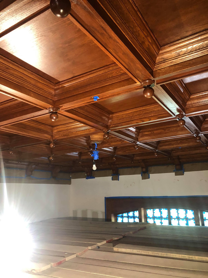 A newly installed or refinished detailed wooden coffered ceiling by USA Contractors in Danbury, CT.
