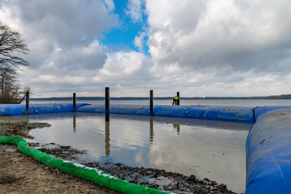 A dewatering construction site with a blue water barrier by Wilkinson Excavating, Inc. in Meadville, PA