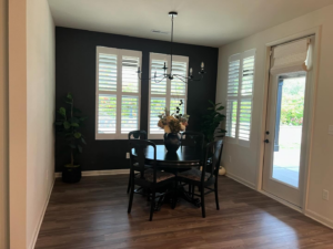 A beautifully painted dining room with a dark accent wall by Wilder Painting, LLC in Quincy, MA