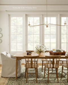 A stylish linear chandelier illuminating a dining room, expertly installed by Wiersma Homes handyman services in Knoxville, TN.