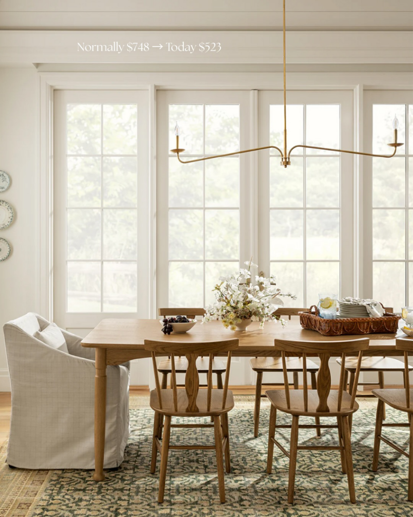 A stylish linear chandelier illuminating a dining room, expertly installed by Wiersma Homes handyman services in Knoxville, TN.
