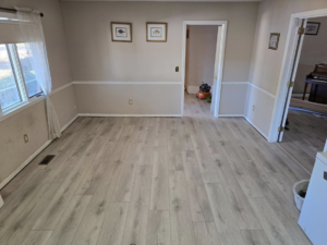 Freshly installed light hardwood flooring in a dining room by Refined Hardwood Flooring LLC in Wilmington, NC