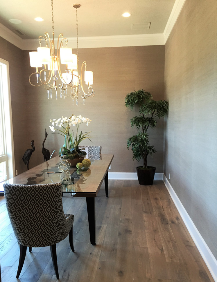 Elegant dining room with textured wallpaper and chandelier installation by T. Wheeler Homes, LLC in Salem, OR