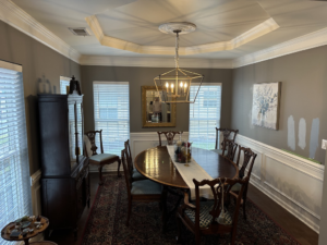 A dining room wall with paint swatches for color selection by Sherwood Painting Services in Mooresville, NC.