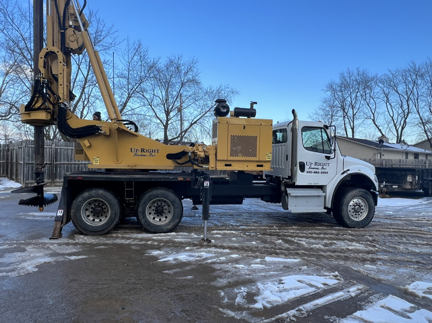 A large truck with directional drilling and augering equipment for Upright Services Inc in Green Bay, WI.