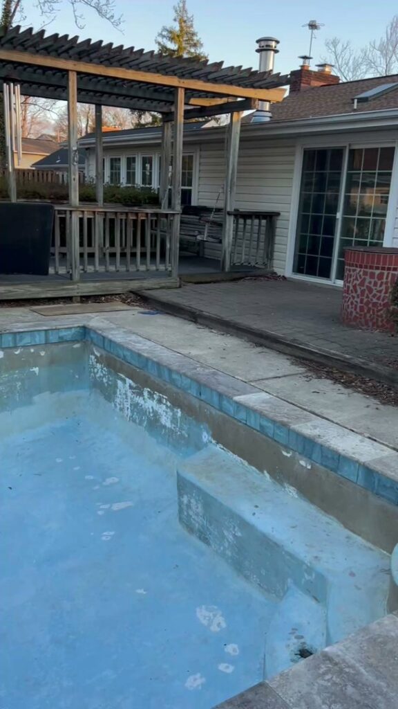 A dirty swimming pool in need of cleaning or resurfacing by Top Notch Sandblasting LLC in Randallstown, MD