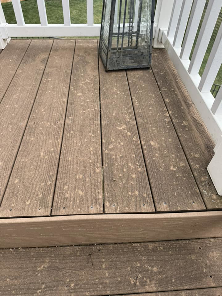 A dirty and weathered wooden deck, showing the need for cleaning or refinishing services by Larson Exteriors in Sunset Hills, MO.