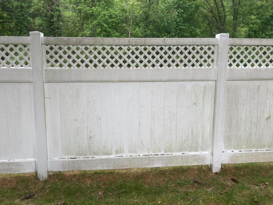 A dirty white lattice fence before professional cleaning service by Connecticut Painting Group, Inc in North Haven, CT