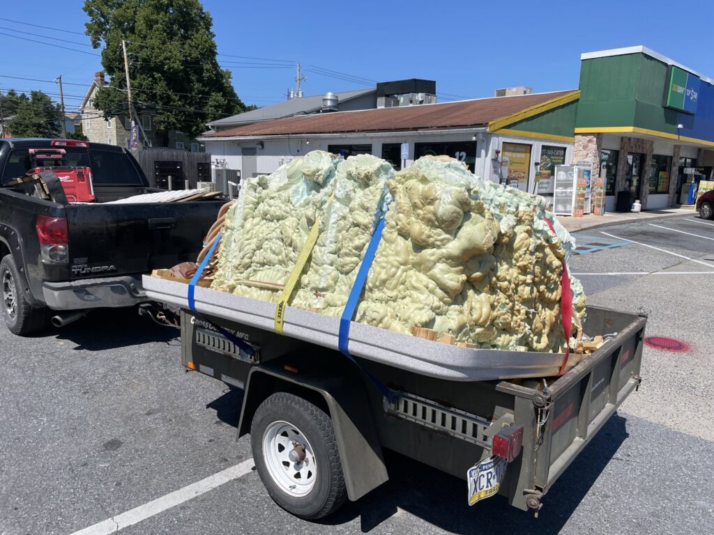 A dismantled hot tub being hauled away on a trailer by Nu Earth Hauling and Recycling, providing junk removal in Allentown, PA.