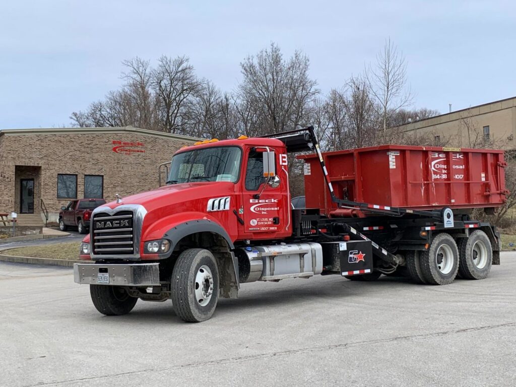 A Beck Disposal Inc. truck with a roll-off dumpster parked in St. Louis, MO