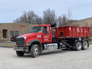 A Beck Disposal Inc. truck with a roll-off dumpster parked in St. Louis, MO