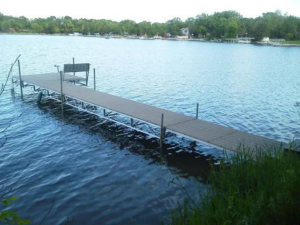 A newly installed dock extending into the lake by Walks On Water, Inc in Clear Lake, MN