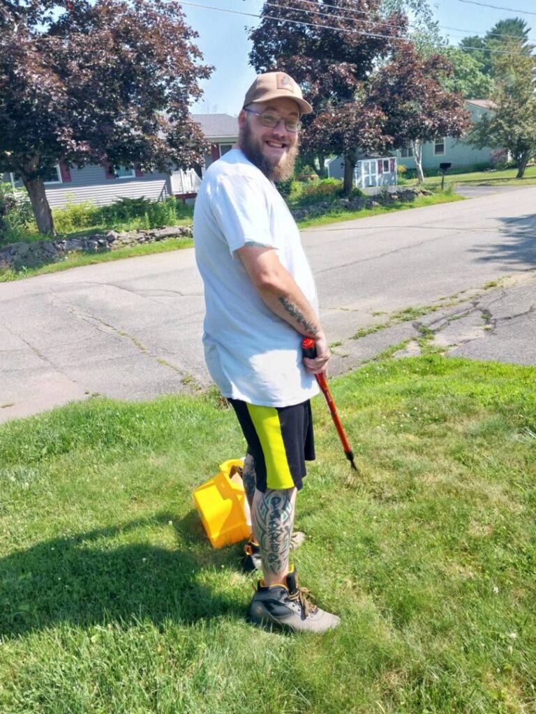 A dog waste removal specialist from The Doo Doo Dudes in Lewiston, ME, ready for service.
