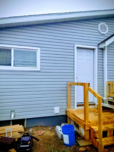 New door installation, deck framing, and siding work by Investment Handyman Services in Pocatello, ID