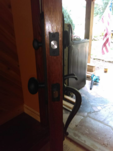 Close-up of a door lock mechanism and handles being installed by Fryes Renovation and Improvements in Johnson City, TN.