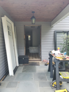 A door replacement project in progress, with new doors ready for installation by Small Jobs Well Done in Avon, CT.