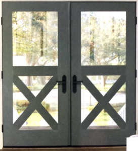 Newly installed double green patio doors with glass and X-bracing by The Window & Door Gallery in Elizabethtown, KY.