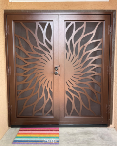 Double security screen door with a decorative leaf design installed by Steel Creations & Fabrication, INC in Glendale, AZ