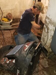 A Fletchers Plumbing and Heating technician performing drain cleaning and inspection in Smyrna, DE