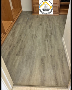 A dressing room with newly installed wood-look vinyl plank flooring by Northern Nevada Handyman Repairs LLC in Reno, NV