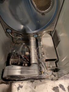 The internal components of a dryer exposed for repair or maintenance by Appliance Handyman of Twin Falls, ID