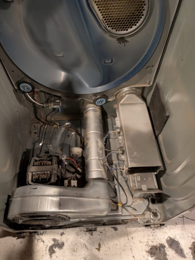 The internal components of a dryer exposed for repair or maintenance by Appliance Handyman of Twin Falls, ID