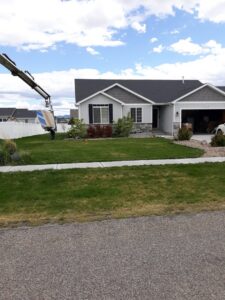 Drywall being delivered by crane to a house for a renovation project by Eagle Rock Handyman Services in Caldwell, ID.