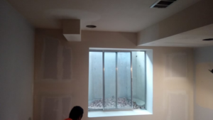 Drywall finishing with mudding and taping in a room by Continental Drywall in Aurora, CO