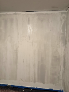An interior wall undergoing drywall finishing, highlighting the quality handyman work of Byrd Property Restoration, LLC in Parkersburg, WV.