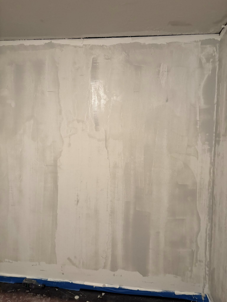 An interior wall undergoing drywall finishing, highlighting the quality handyman work of Byrd Property Restoration, LLC in Parkersburg, WV.