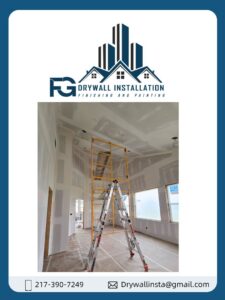Drywall finishing work in progress with scaffolding in a tall room by FG Drywall, Finishing and Painting in Champaign, IL.