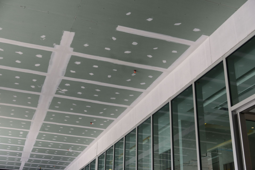 New drywall installation and finishing on a ceiling, a service provided by Nail Builders, Inc. in Littleton, CO