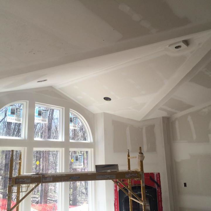 Interior view of a room with new drywall installation and finishing work in progress by Schultz Drywall, Inc. in O'Fallon, MO.